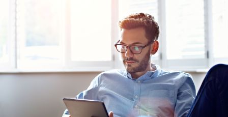 Man on couch with ipad