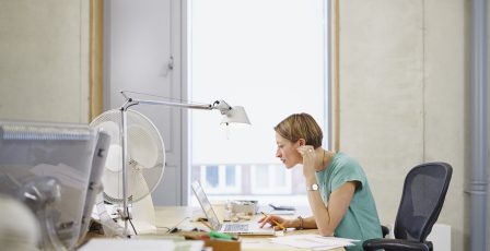 Woman sitting behind her laptop