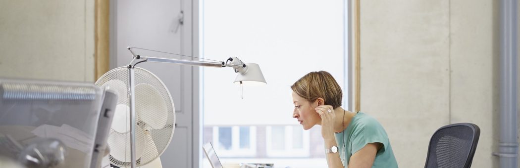 Woman sitting behind her laptop